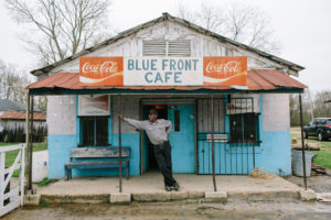 Bentonia, MS - 3/11/2015 - Jimmy "Duck" Holmes stands on the front porch of The Blue Front Cafe. The Blue Front Cafe opened in 1948 under the ownership of Carey and Mary Holmes, an African American couple from Bentonia. In its heyday the Blue Front was famed for its buffalo fish, blues, and moonshine whiskey. Jimmy "Duck" holmes took over the cafe from his parents in 1970 and has continued to operate it as an informal, down-home blues venue that has gained international fame among blues enthusiasts.